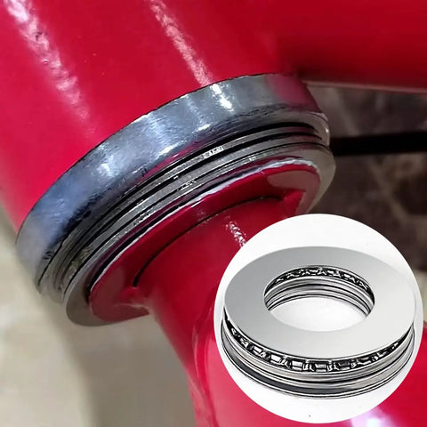 Close-up of Two Sets AXK2035 Thrust Needle Roller Bearings With AS2035 Washers 20mm ID, installed on lawn mower axle