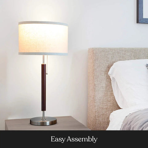 Carter LED Bedside Lamp With Soft Ambient Glow For Bedroom And Office, stainless steel base, walnut finish, on nightstand