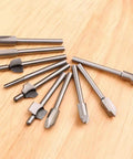 Ten Piece HSS Router Bit Set With One Eighth Inch Shank For DIY Woodworking displayed on wooden surface