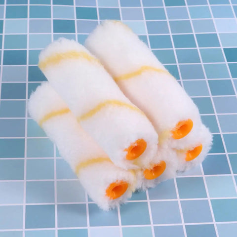 Five foam roller covers featuring yellow stripes for the Twenty Piece Mini Paint Roller Kit Featuring Slick High Density Foam Covers Crafted For Tight Spots And Smooth Wall Jobs The Portable Setup Makes Home Touchups A Total Cinch And Guarantees Straight Up Slick Results Every Single Time.