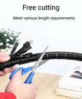 16.4 Feet Spiral Cable Wrap That Makes Winding A Breeze Coiled Cord Sleeve Tube Cover being cut with scissors