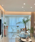 Smooth 10W Dimmable Cob Led Spotlight 12 Pack illuminating a modern living room with plants and stylish decor.