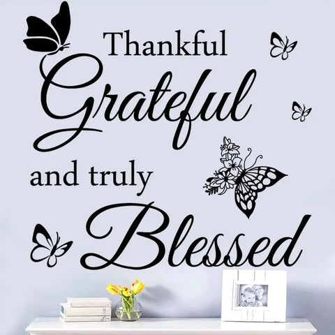 Thankful Grateful And Truly Blessed Inspirational Quote Vinyl Wall Decor with butterflies on a living room wall.