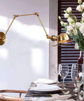 Top Shelf Heavy Duty Metal Swing Arm Wall Sconce Featuring Smooth Adjustable E27 Bulb Socket For Modern Bedrooms And Hallways with brass finish.