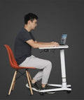 Rock Solid Rolling Laptop Cart With Height Adjustable Standing Desk and Smooth Glide Wheels For Bed Sofa Gaming Or Home Office Flex Setup, side view of user typing on laptop