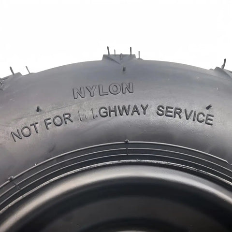 Close-up of Beefy 16x8-7 ATV Tire With Rim showing nylon material and 'Not for Highway Service' text