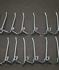 Sixteen Heavy Duty Replacement Peg Hooks For Storing Shop Tools On Brake Lathe Bench Stands To Keep Your Garage Layout Shootin Straight And Ready To Roll displayed on dark surface.