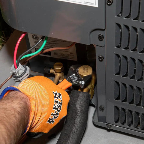 Using Beefy Adjustable Wrench With Extra Capacity Jaw For Bigger Jobs In Tight Spaces One And A Half Inch Capacity Precision Forged Steel SAE And Metric Scales Plastic Dipped Handle Six Inch Heavy Duty Grip For Pro Level Fixes on HVAC unit.