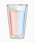 Transparent glass with half pink liquid and half blue liquid, perfect for showcasing stunning beverage presentations.