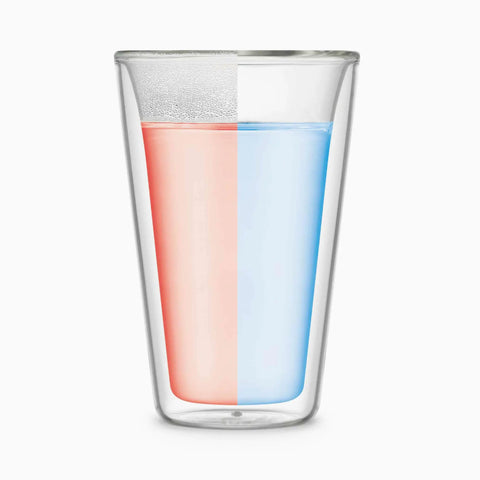 Transparent glass with half pink liquid and half blue liquid, perfect for showcasing stunning beverage presentations.