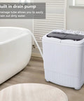 Zero Drama Portable Twin Tub Mini Washing Machine with built-in drain pump and drainage tube in a bathroom setting.