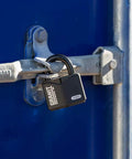 Granit Alloy Steel Padlock With Beefy Hardened Shackle Keyed Different High Security Lock securing a blue metal gate.