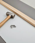 Sleek Plastic Fridge Door Stopper With Reliable Catch Hook For Modern Kitchens, installation tools including hammer and hook.
