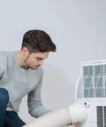 Person installing 5.9 Inch to 6 Inch portable AC exhaust hose, 78.7 Inch length universal replacement with counterclockwise thread on AC unit.