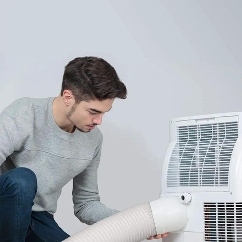 Person installing 5.9 Inch to 6 Inch portable AC exhaust hose, 78.7 Inch length universal replacement with counterclockwise thread on AC unit.