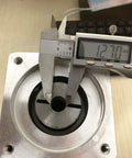 Close-up of Beefy 10 To 1 Planetary Gearbox Reducer Nema 34 with 12.7mm input shaft and 86mm flange being measured with a caliper.