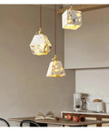 Industrial Marble Pendant Light Fixture Chandeliers hanging above a dining table in a modern kitchen setting.