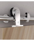 Heavy Duty Sliding Barn Door Hardware Kit In Brushed Stainless Steel featuring rollers and top mount setup for smooth glide action.