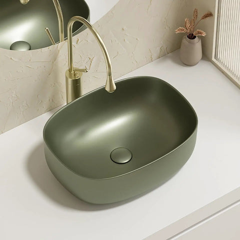 Retro Green Ceramic Above Counter Bathroom Vessel Sink, Artistic Curved Design, Scratch-Resistant & Easy-to-Clean Vanity Sink for Home, Balcony, Guest Bath (23.6in/60cm) viewed from top with faucet.
