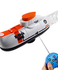 Super Cool RC Submarine Toy For Surface And Deep Water Diving with remote control, white and orange, kid friendly.