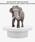 Electric Motorized Rotate Display Stand With 360 Degree Spin For Jewelry And Watches Plus Full Angle Photography Setup Using USB Power displaying an elephant.