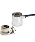 Stainless Steel Turkish Inspired Coffee Pot 24 Oz For Rich Smooth Turkish Coffee At Home Durable Kitchen Essential For Coffee Nerds And Lovers Classic Design Easy Pour Perfect For The Crew next to brewed coffee and beans.