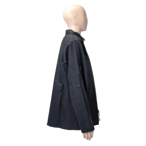 Side view of black flame-resistant 9 oz cotton welding jacket, large size, on mannequin, shields arms and torso from spatter and heat.