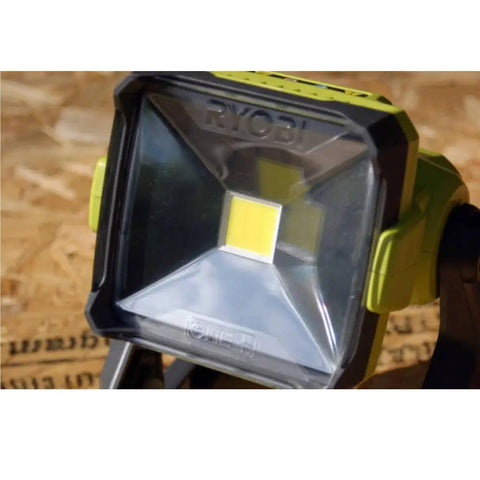 Close-up of 18V Dual Power LED Work Light with 20 Watt LED showcasing the front lens and housing on a wooden surface.