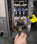 Adjustable 4 To 8 Inch Screwdriver With Removable Shaft Dual Tips Phillips Size 2 And One Quarter Inch Slotted in use on electrical panel