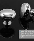 Two polished chrome cabinet knobs in solid zinc alloy, reflecting light; 5 Pack Polished Chrome Cabinet Knobs, Round Drawer Handles For Kitchen Cabinets, Doors, Bathroom Vanities, Closets, Dressers, Easy Install Zinc Alloy Set For Doors And Drawers.