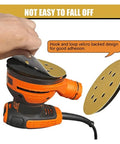 Hand applying a 5 inch hook loop sanding disc to an orbital sander, showing strong adhesion for effective surface prep.