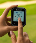 Golfer using Phantom 3 Slope GPS Handheld For Golf With 38,000+ Courses, Auto Course Recognition on the green.