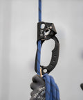 Passport Handled Rope Ascender with ergonomic rubber grip on blue rope, compact design, black left hand model