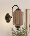 RONGHUAFUGUI Vintage Modern Wall Sconce with Amber Glass featuring a curved arm and ribbed amber glass shade.