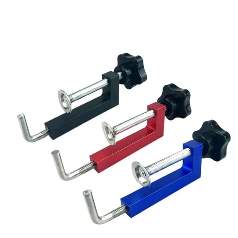 Dead Easy Quick Release Aluminum Miter Clamps With Killer 600 Pound Grip And Non Marking Rubber Pads For Smooth Picture Frame Assembly And Shop Projects Done Right, featuring black, red, and blue clamps.