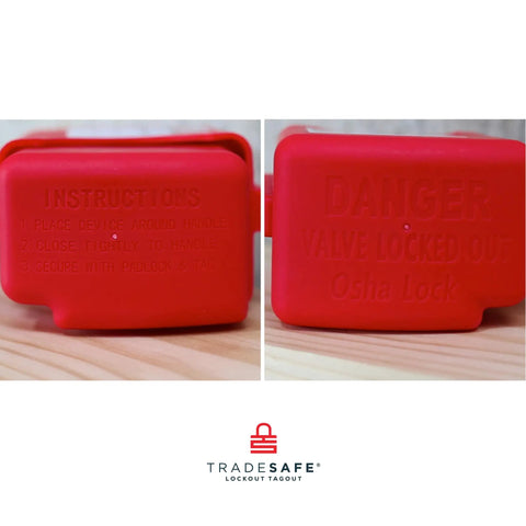 Close-up of a red adjustable flanged ball valve lockout for two inch to four and one half inch flanges, industrial use, OSHA compliant.