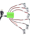 Six Pack 3.7V 220mAh Drone Batteries And Six In One Balance Charger displaying batteries connected to green charger