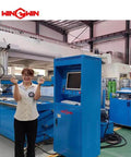 Two adjustable nozzle body parts (P-III) held by technician in front of blue water jet cutting machine