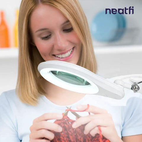 Woman using LED Bifocal Magnifying Lamp With 1,200 Lumens, Dual 2.25X And 6X Magnification, 5 Inch Glass Lens for knitting