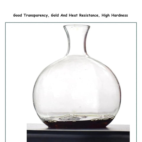 Kickstart Your Morning Routine With This Hella Smooth Cold Brew Coffee Tower Featuring A Slow Drip Ice Coffee Brewer With Adjustable Flow Control And Spacious Glass Container Pouring Five To Eight Cups Of Top Tier Chilled Java For Daily Office Use. Clear glass carafe with a round base for cold brew coffee preparation.