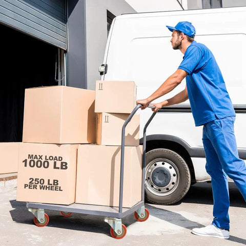 Person using 4 Pack Swivel Plate Stem Casters With Red Polyurethane Wheels, 3 Inch Wheel Diameter for moving boxes on a cart
