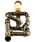 Steampunk Robot Table Lamp With Vintage Industrial Water Pipe Design, rustic bronze, quirky desk light for nightstand or café.