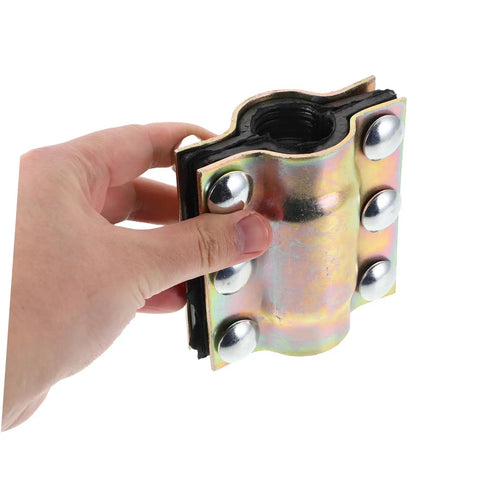 Close-up of Leak Sealer Clamp For Plastic And Metal Pipes Waterproof Pipe Repair Kit in hand, showing metal and rubber details