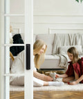 Heavy Duty Peel And Stick Cabinet Handles Six Inch Black Adhesive Drawer Pulls on a glass sliding door in a living room.
