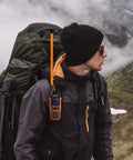 Hiker with backpack using Orange SMA-Female Tactical Ham Radio Antenna 18.8 Inch Foldable For 144 To 430 MHz VHF UHF