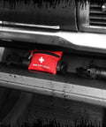 Lightning X Mini First Aid Kit red compact 20-piece emergency pouch with carabiner in a car trunk