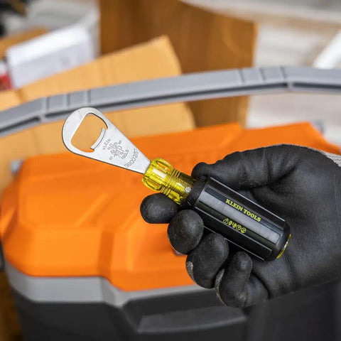 Gloved hand holding a Bottle Opener For Pros With Cushioned Grip Handle And Tip Ident For Quick ID In Pouches Made In USA Heavy Duty
