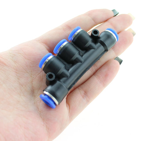 Hand holding Five Way Inline Manifold Fittings Push In Quick Connect For 6mm Tube Outer Diameter 1/4 Inch Air Line High Pressure 0 To 150 PSI