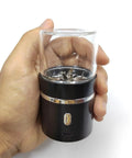 Hand holding On The Go Portable Mini Electric Grinder For Spices And Herbs With 50ml Jar 400mAh Battery Double Leaf
