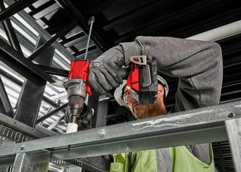 Badass 18V 1/2-Inch Compact Cordless Drill Driver Bit Socket Adapter Compatible With M18 Power System used on metal frame.